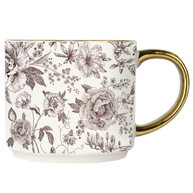 Mug with floral pattern and gold handle on a white background