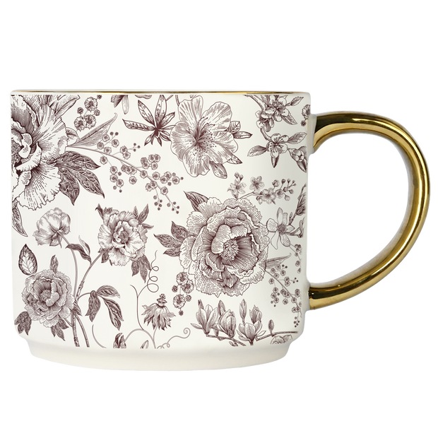 Mug with floral pattern and gold handle on a white background