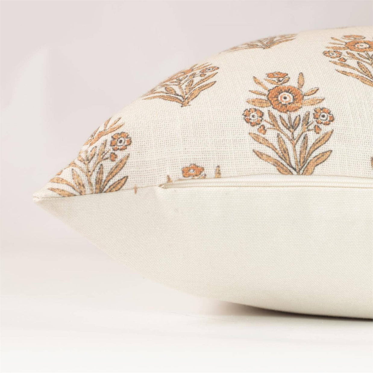 Decorative pillow with floral patterns on a plain background