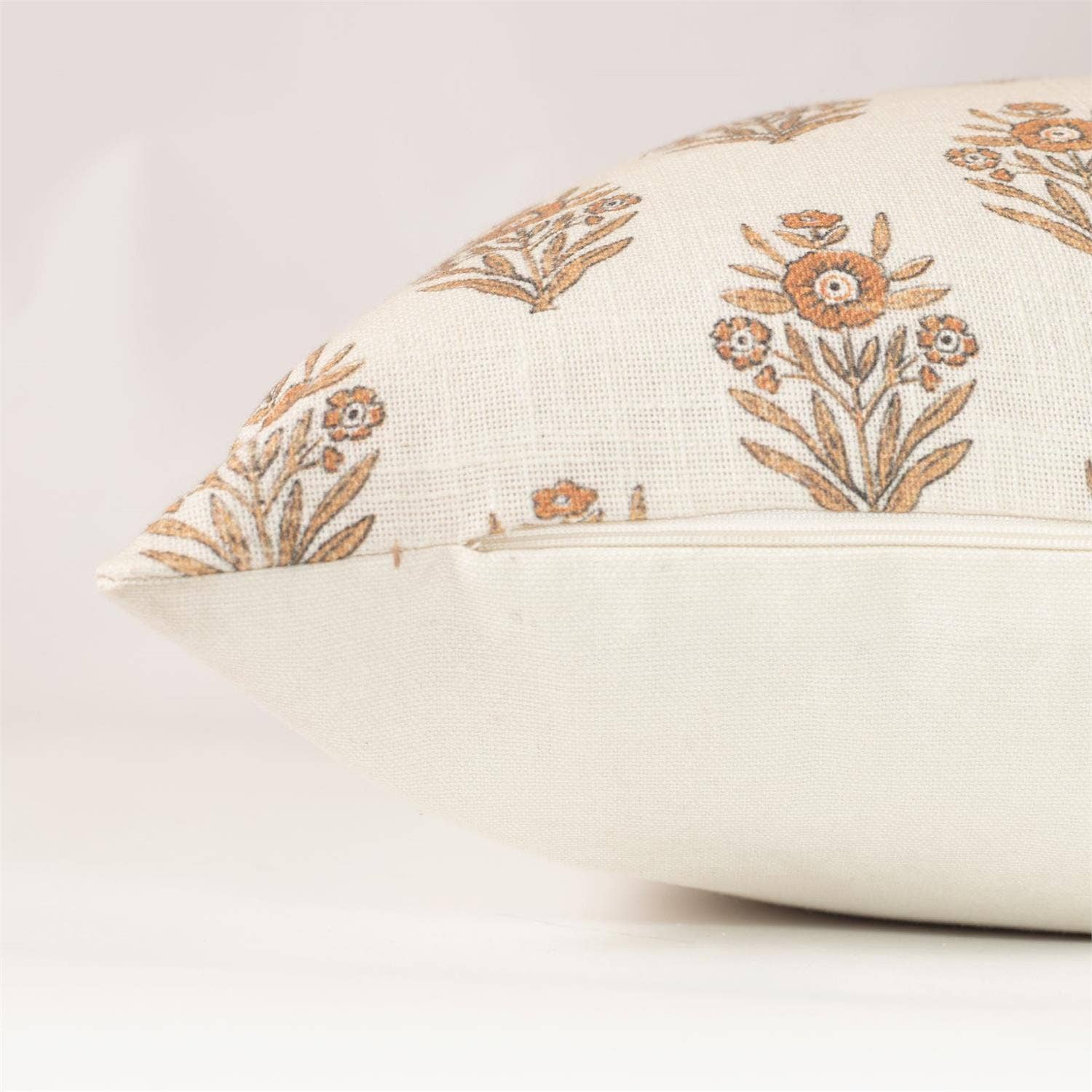 Decorative pillow with floral patterns on a plain background