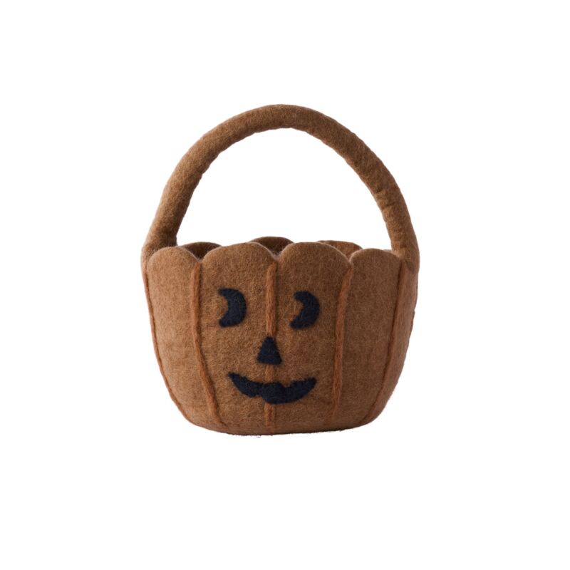 Brown felt pumpkin basket with a face on a white background