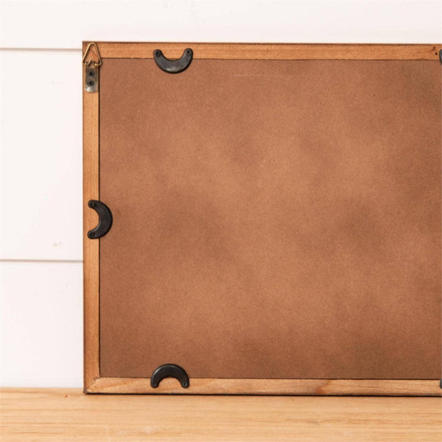 Brown backing of a framed painting. 