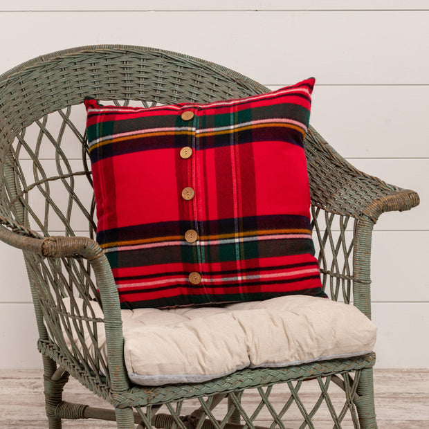 Red Tartan Pillow on wicker chair. 