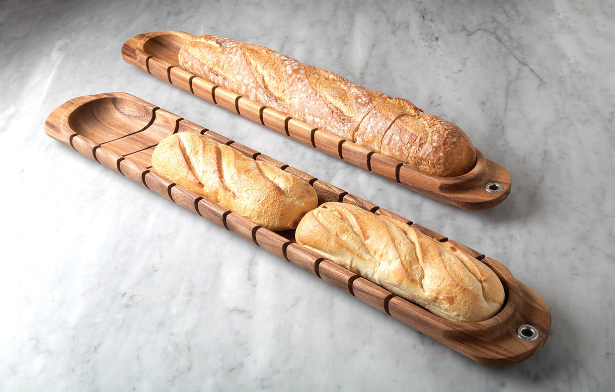 Wooden bread trays with bread on a gray marble surface