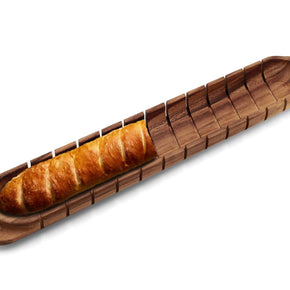 Wooden bread carrier with a loaf of bread on a white background