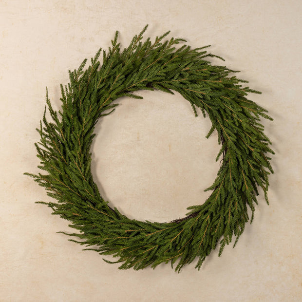 Green wreath on a beige background