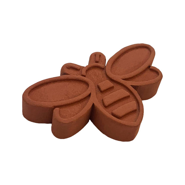 Brown bee-shaped mold on a white background