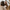 Person holding a brown mug with a blurred background