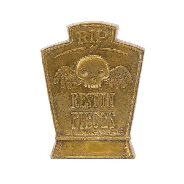 Bronze tombstone with skull design and 'RIP Rest in Pieces' text on a white background