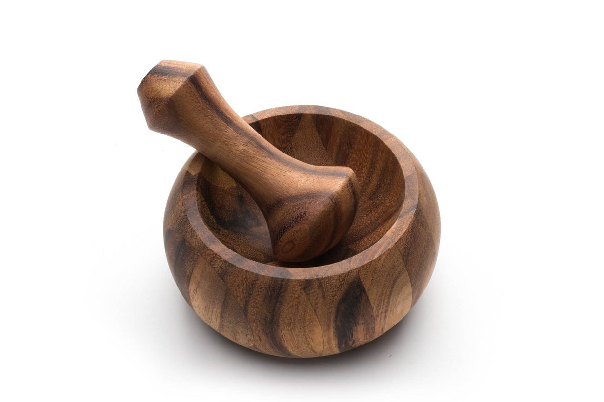 Wooden mortar and pestle on a white background