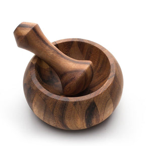 Wooden mortar and pestle on a white background