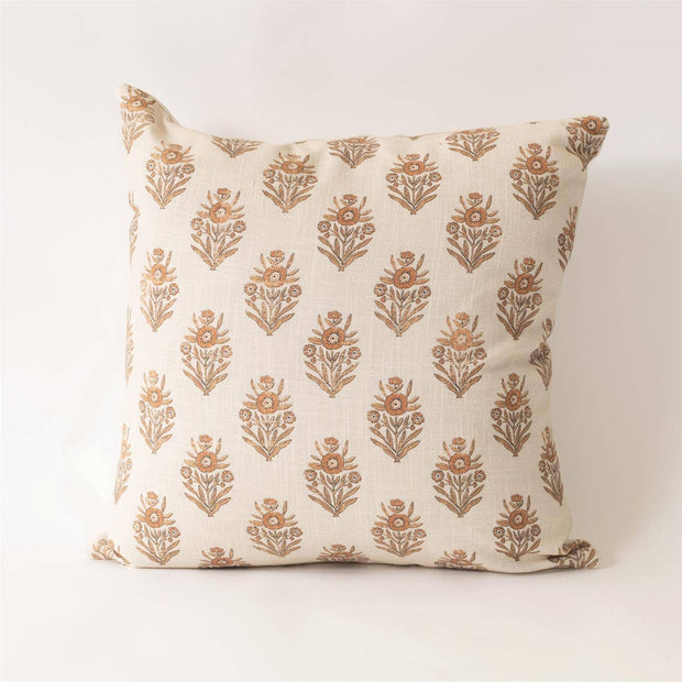 Decorative pillow with floral pattern on a plain background