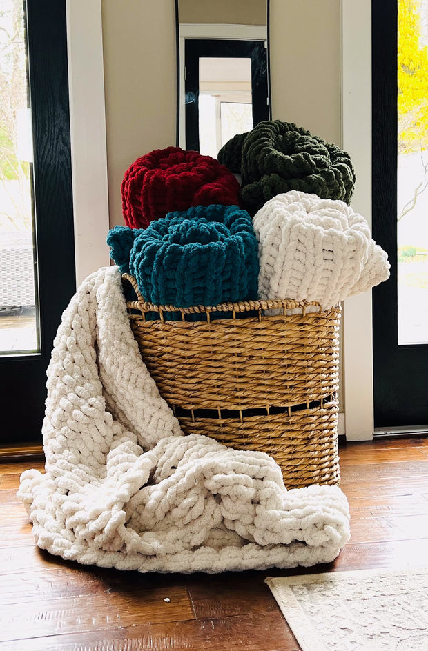 Basket Filled with Large Knit Blankets