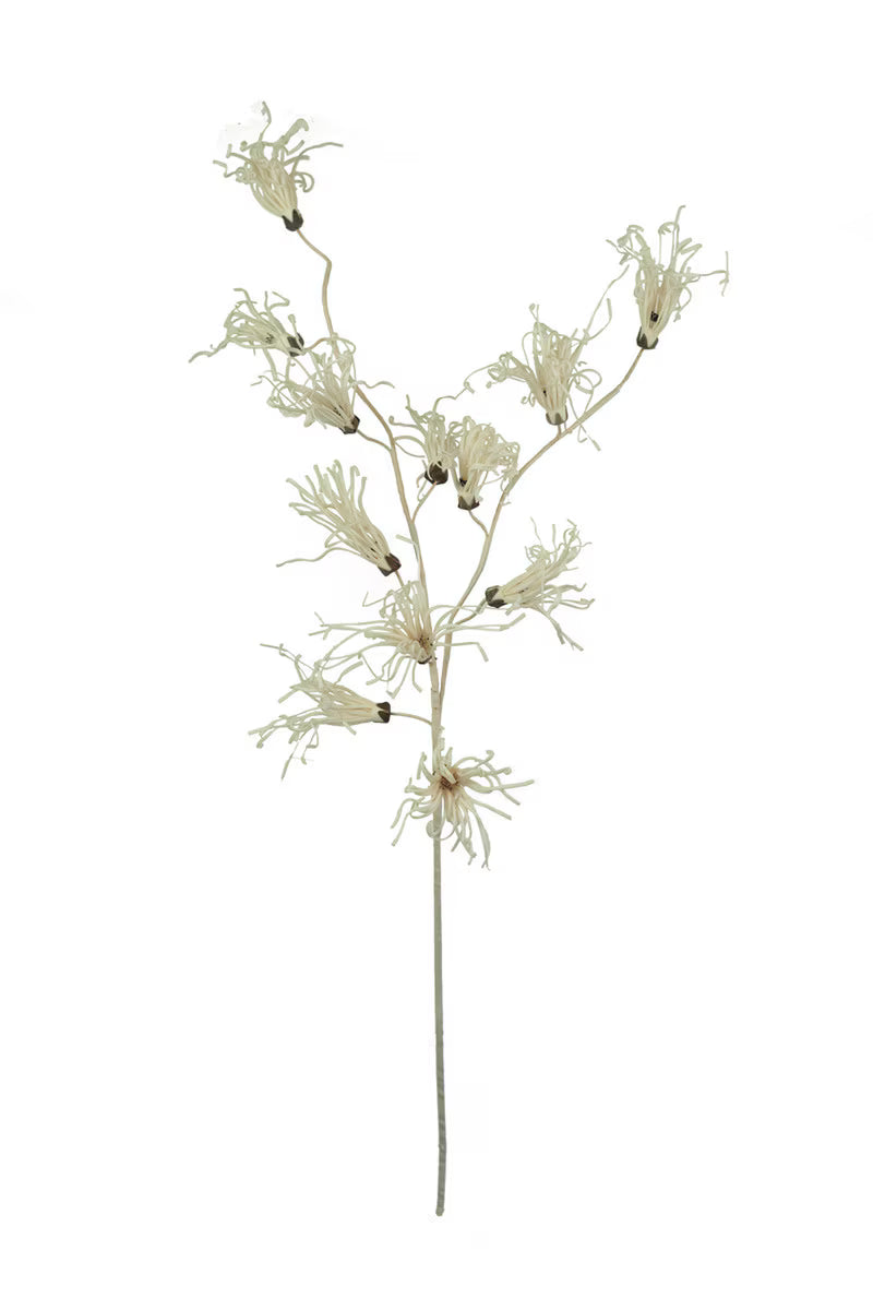 Artificial plant branch with white flowers on a white background