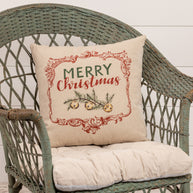 Merry Christmas Pillow on wicker chair. 