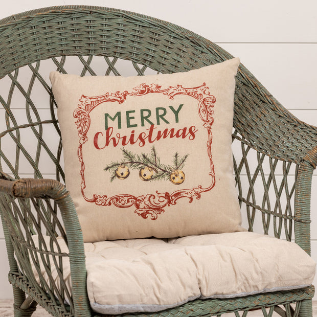 Merry Christmas Pillow on wicker chair. 