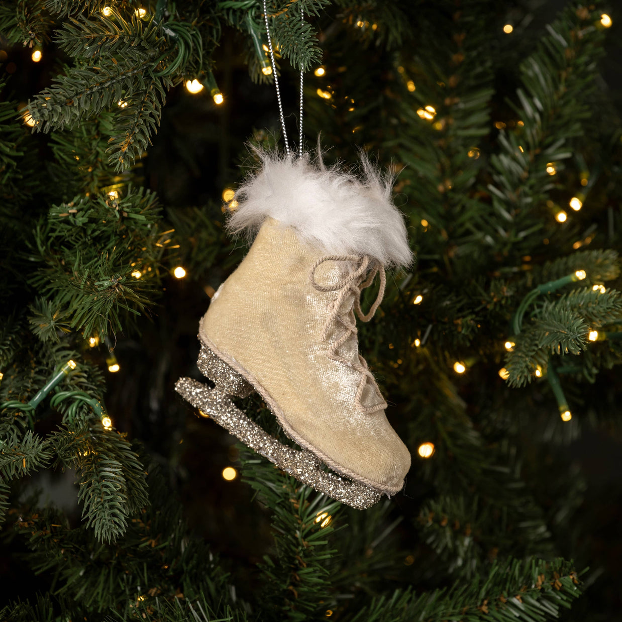 Oatmeal Colored Ice Skate ornament on a tree. 