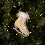 Oatmeal Colored Ice Skate ornament on a tree. 