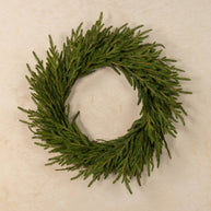 Green wreath on a beige background