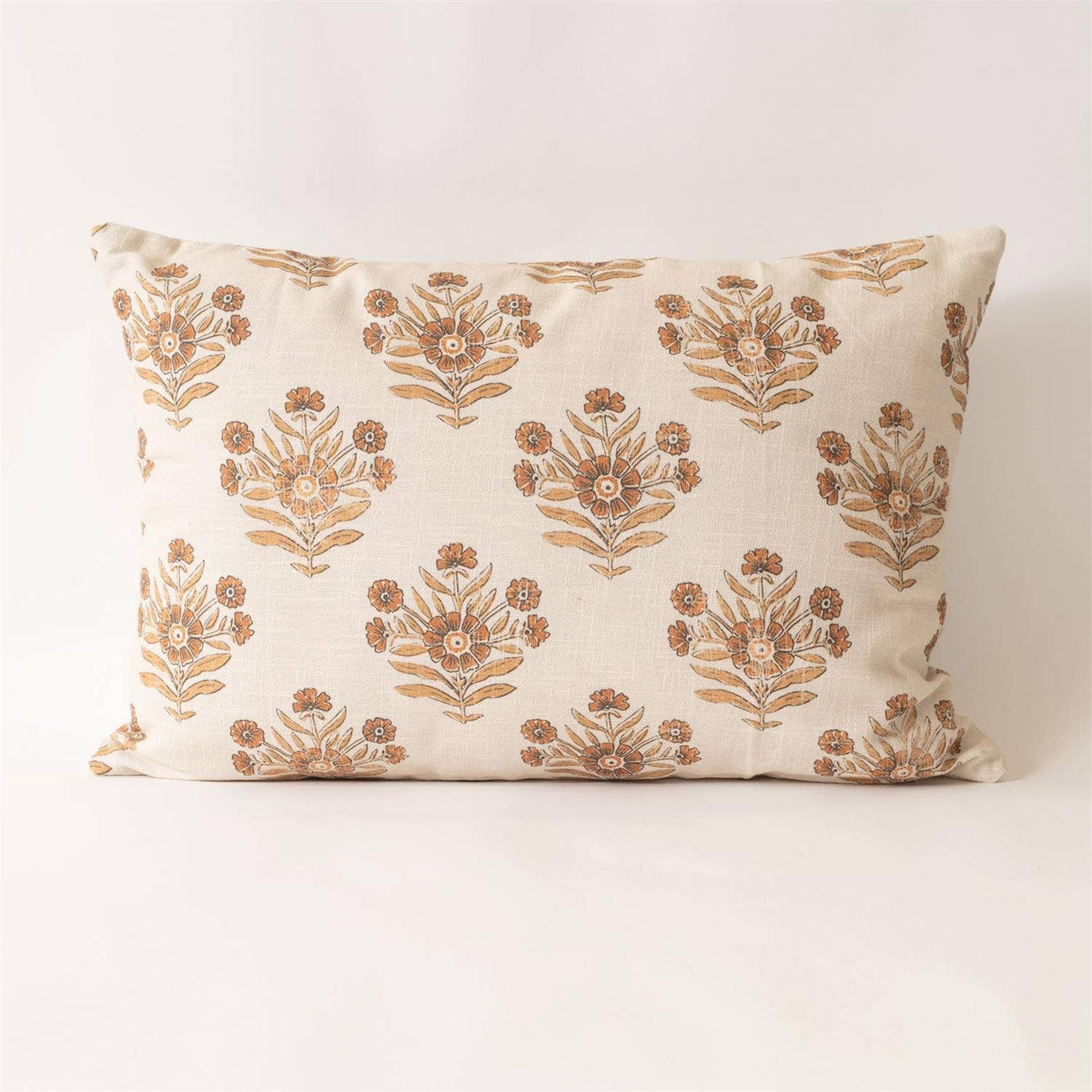 Decorative pillow with floral pattern on a white background