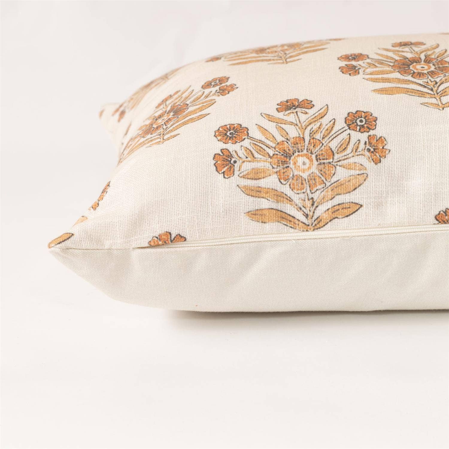 Decorative pillow with floral pattern on a white background