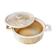 Small ceramic baking dish with a lid on a white background