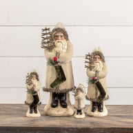 Set of decorative Santa Claus figurines with Christmas elements on a wooden surface.