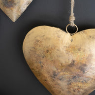 Close up of Set of Three Antique Gold Heart Door Hangars