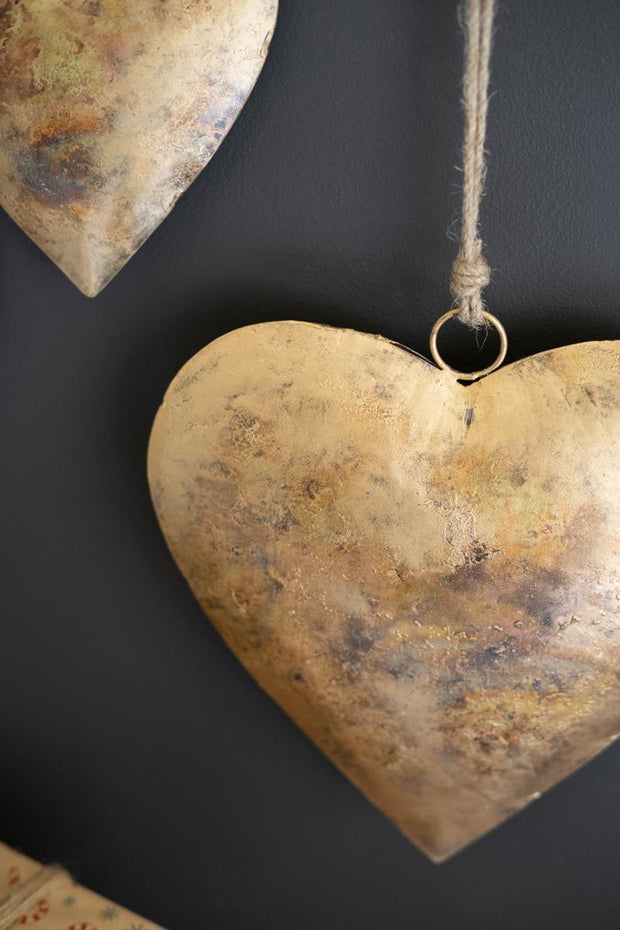 Close up of Set of Three Antique Gold Heart Door Hangars