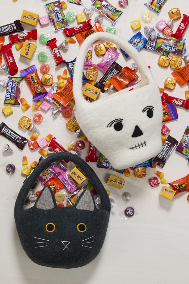 Bat and mummy baskets with assorted candy. 