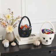 Decorative Easter basket with flowers on a black surface
